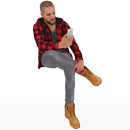 Daniel sitting with phone
